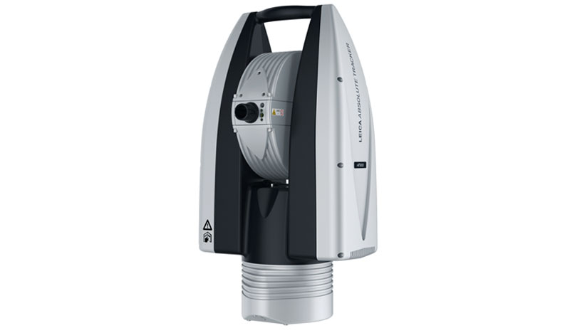 Leica Absolute Tracker, upright grey and black laser tracker with carry handle and rotating optical head