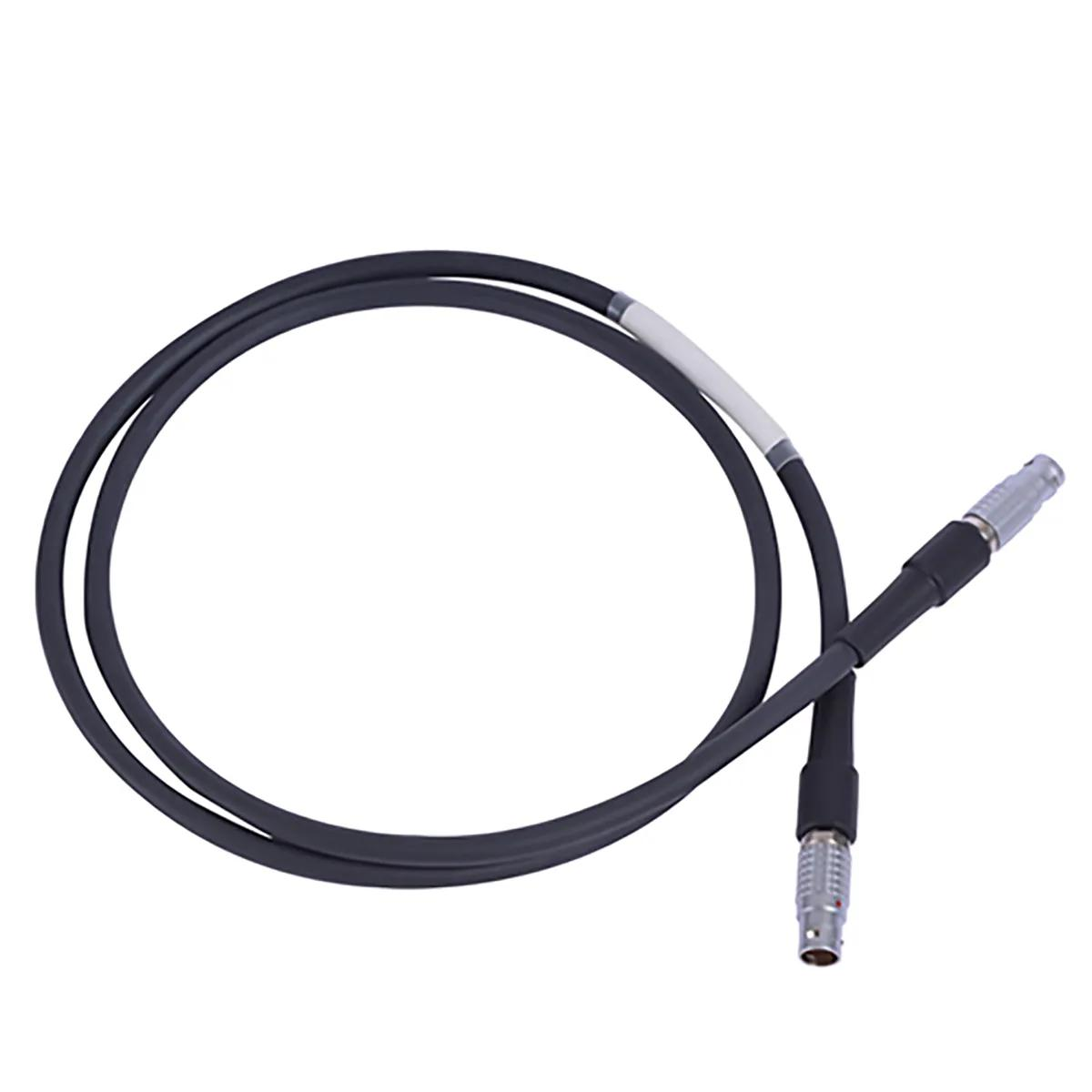 Coiled black tracker-to-controller cable with metal circular push-pull connectors on both ends