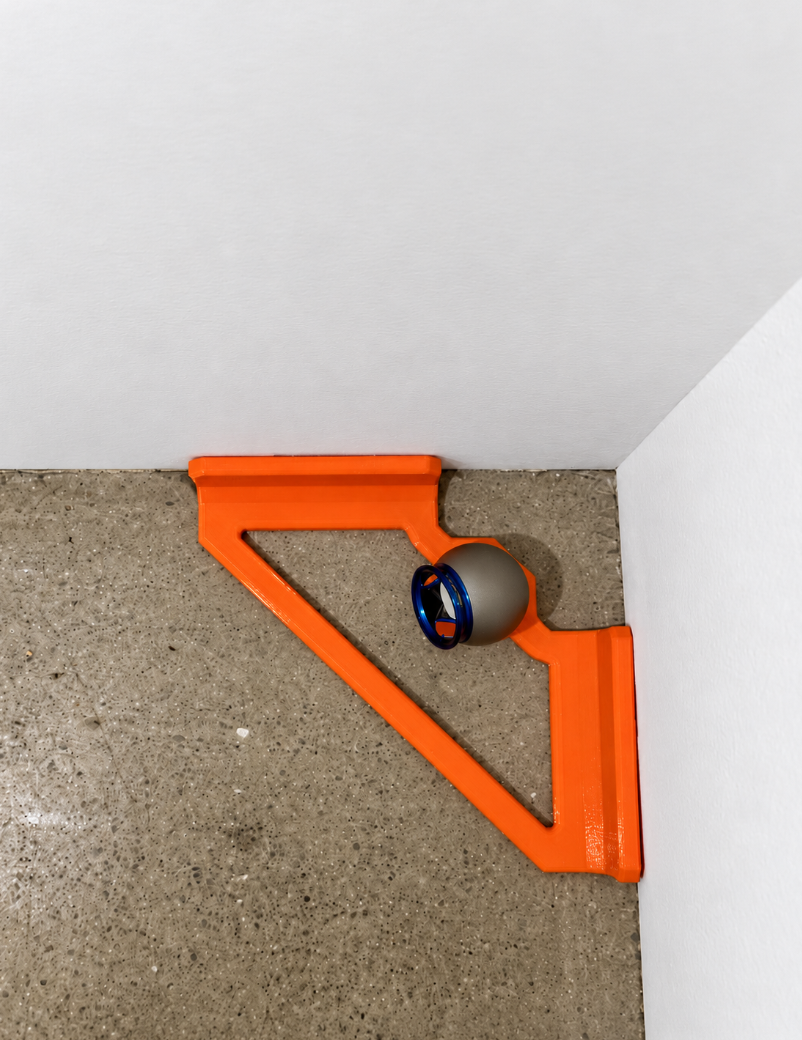 Inside corner control jig pressed into a room corner, holding the Dusty reflector 2 inches off both walls.